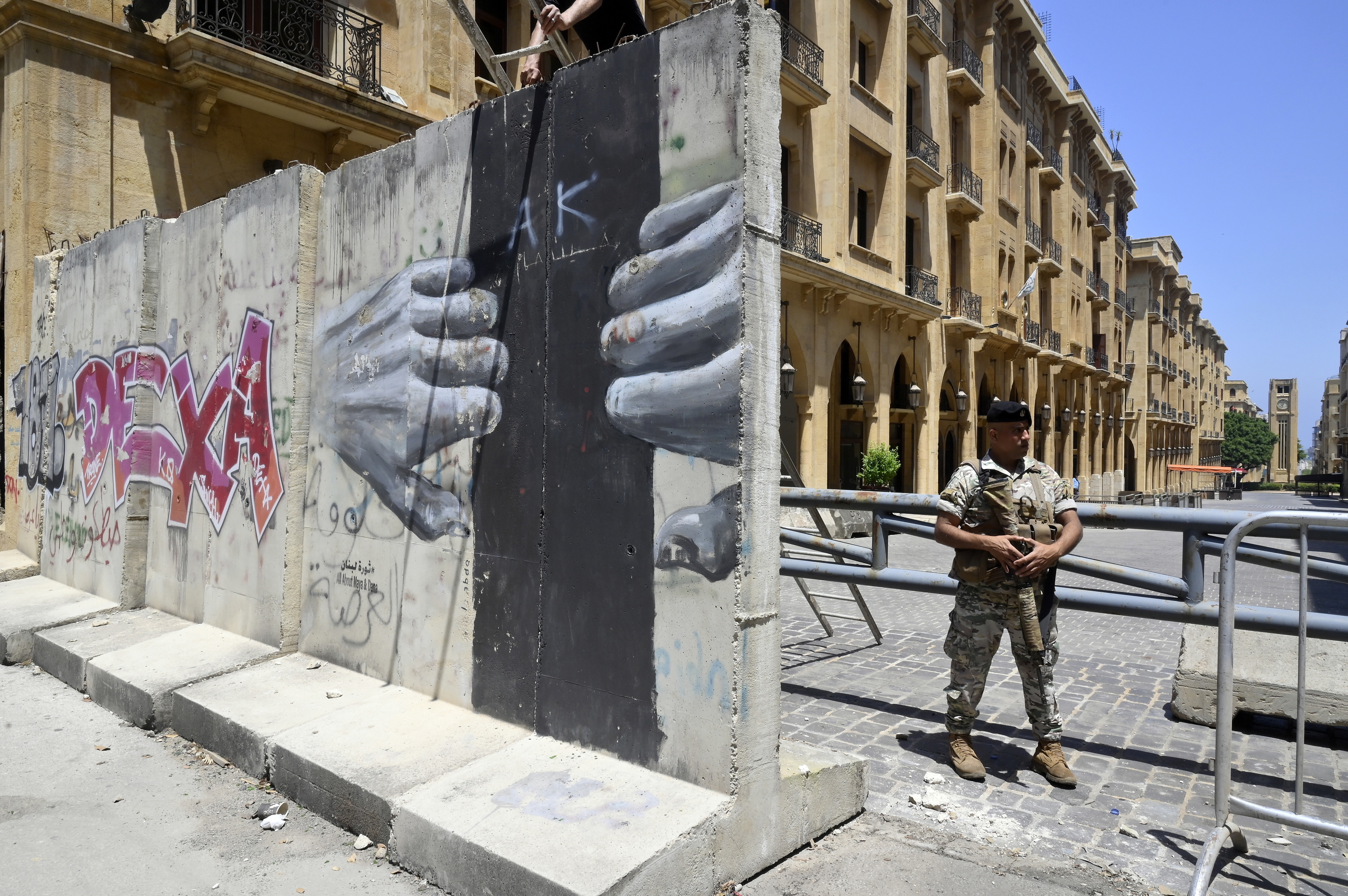 A soldier guards a barrier outside parliament in Beirut.