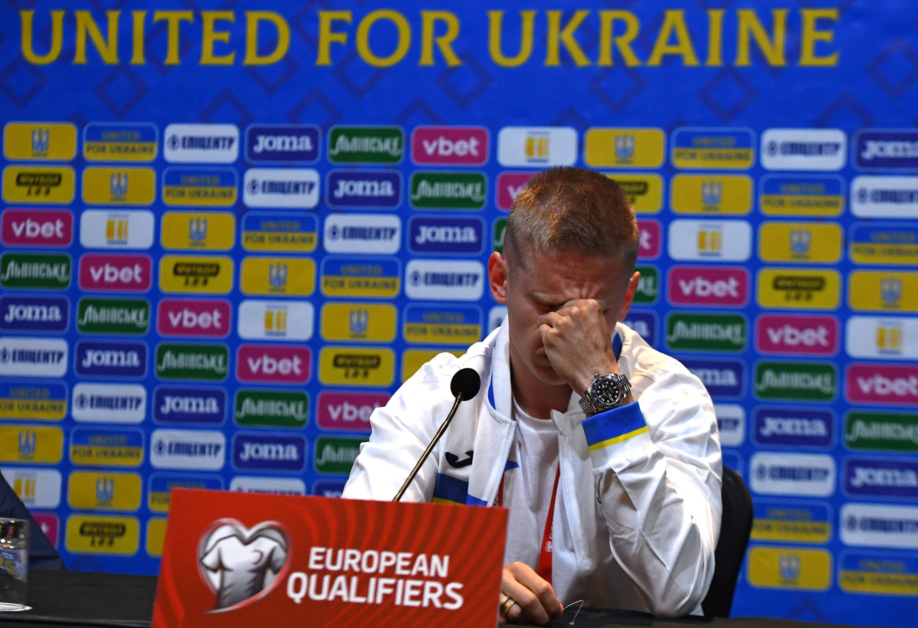 Zinchenko tears during a press conference in Glasgow.