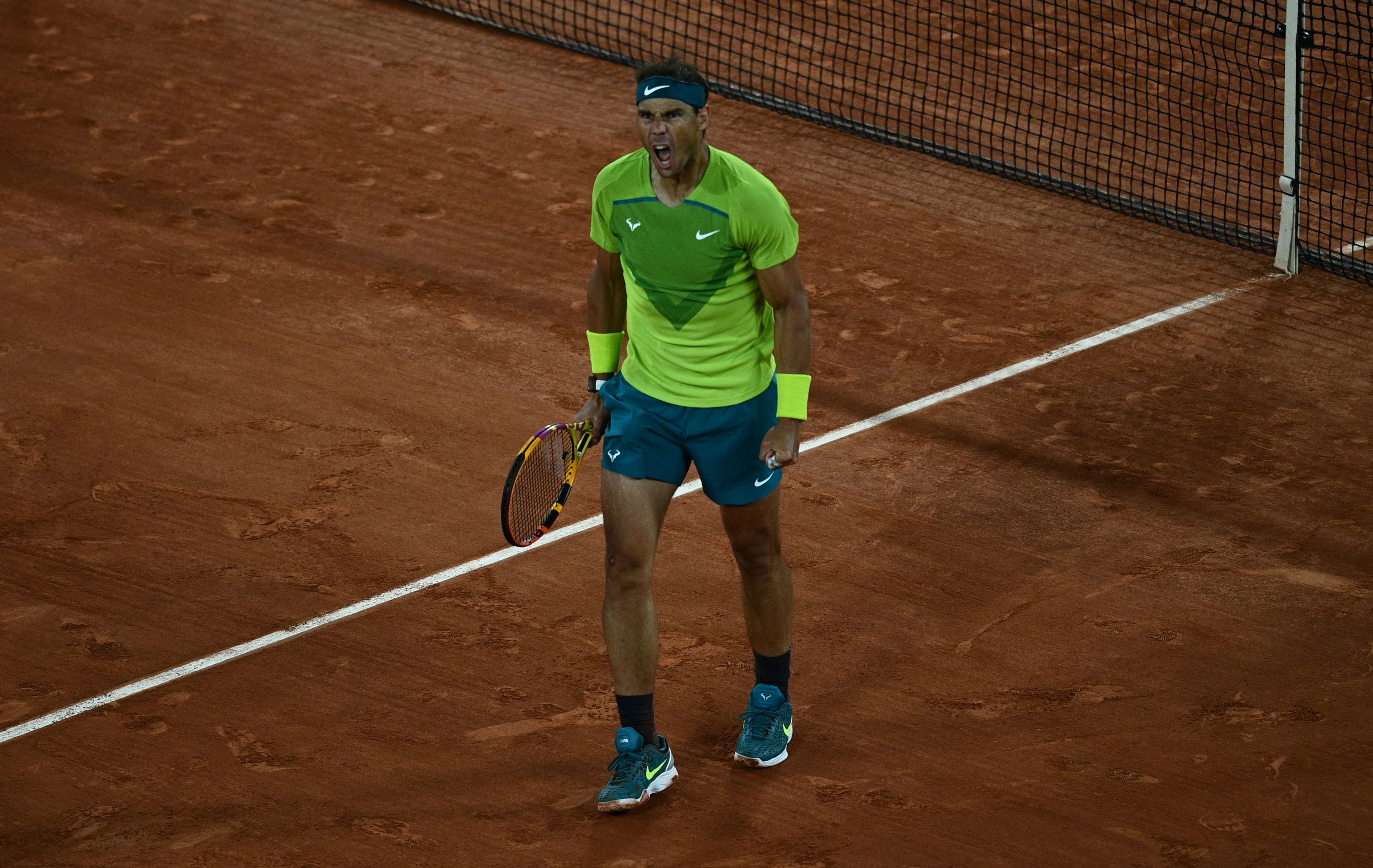 Nadal celebrates a point during the match against Djokovic.