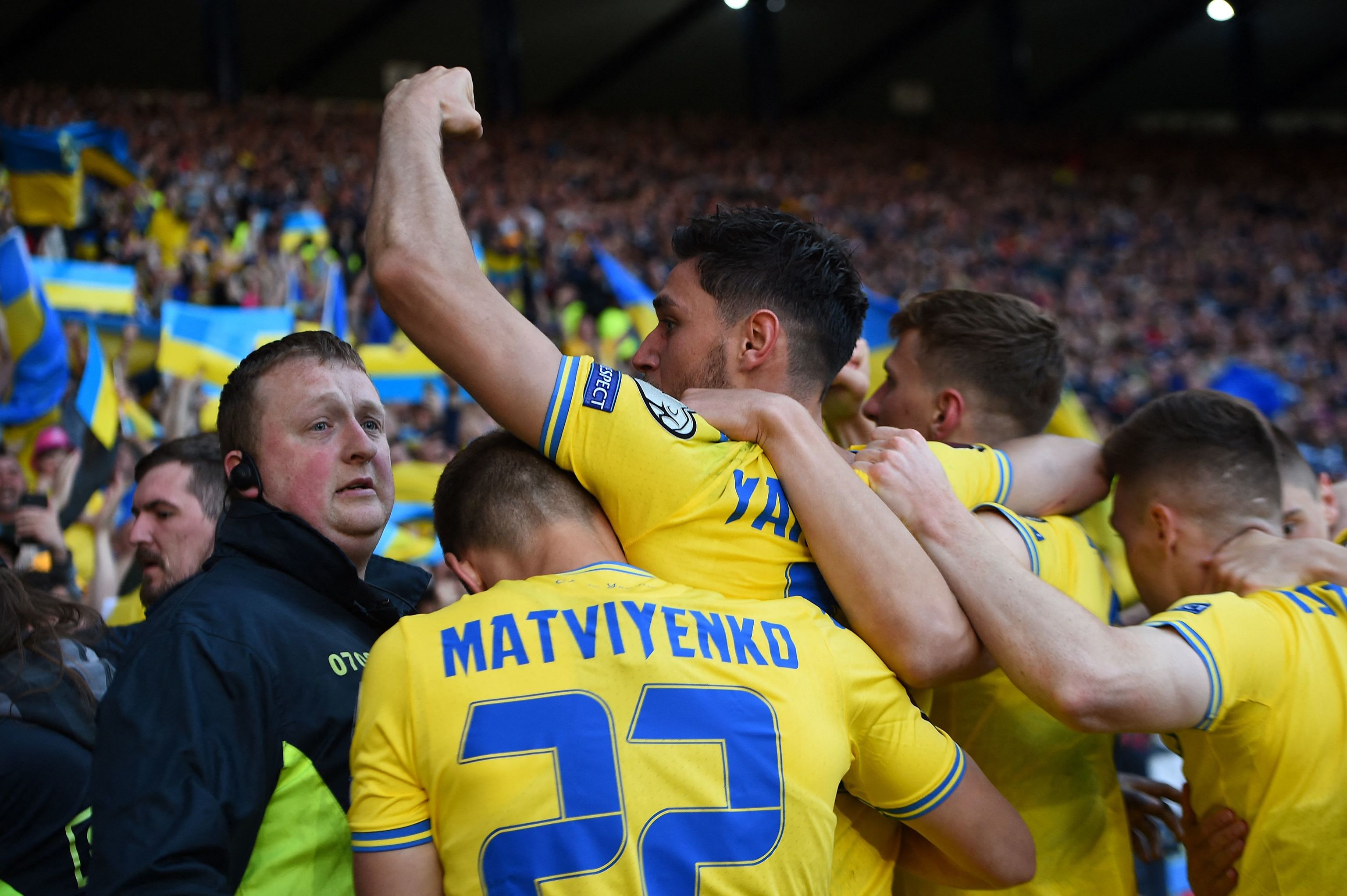 Ukraine's Yaremchuk celebrates his goal in Hampden.