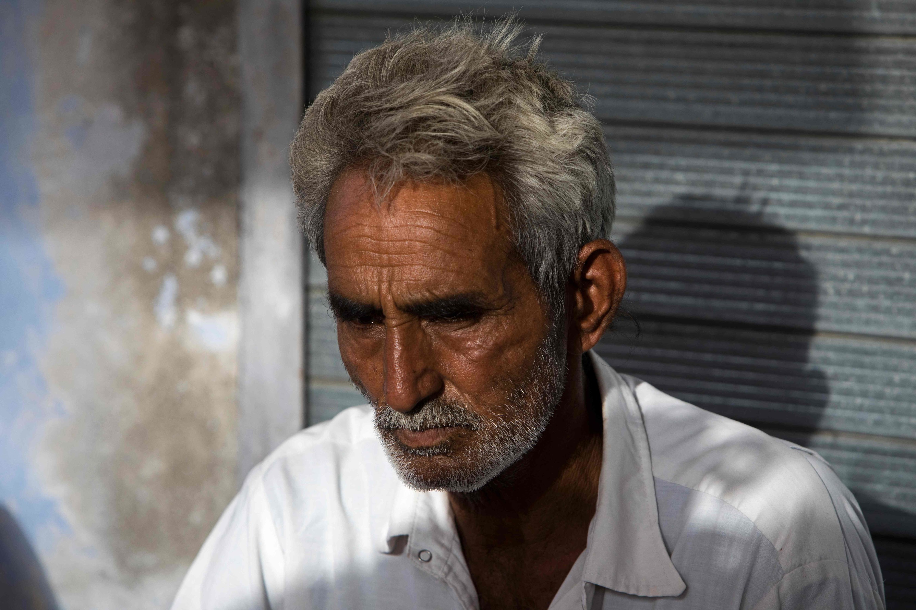 Farmer Sardar Meena mourns his three married daughters and two grandchildren, who were found dead in a well in Dudu village, the family's home in Chhapya village, Rajasthan state, India, on May 28.