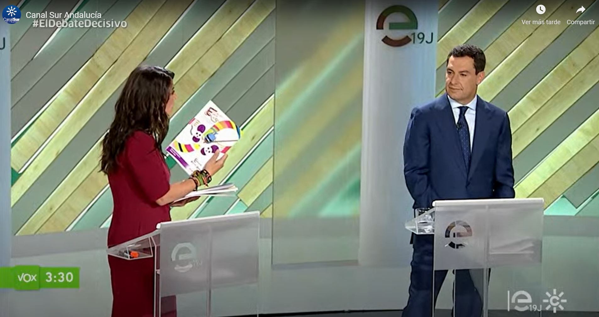 Macarena Olona shows Juanma Moreno the book according to which