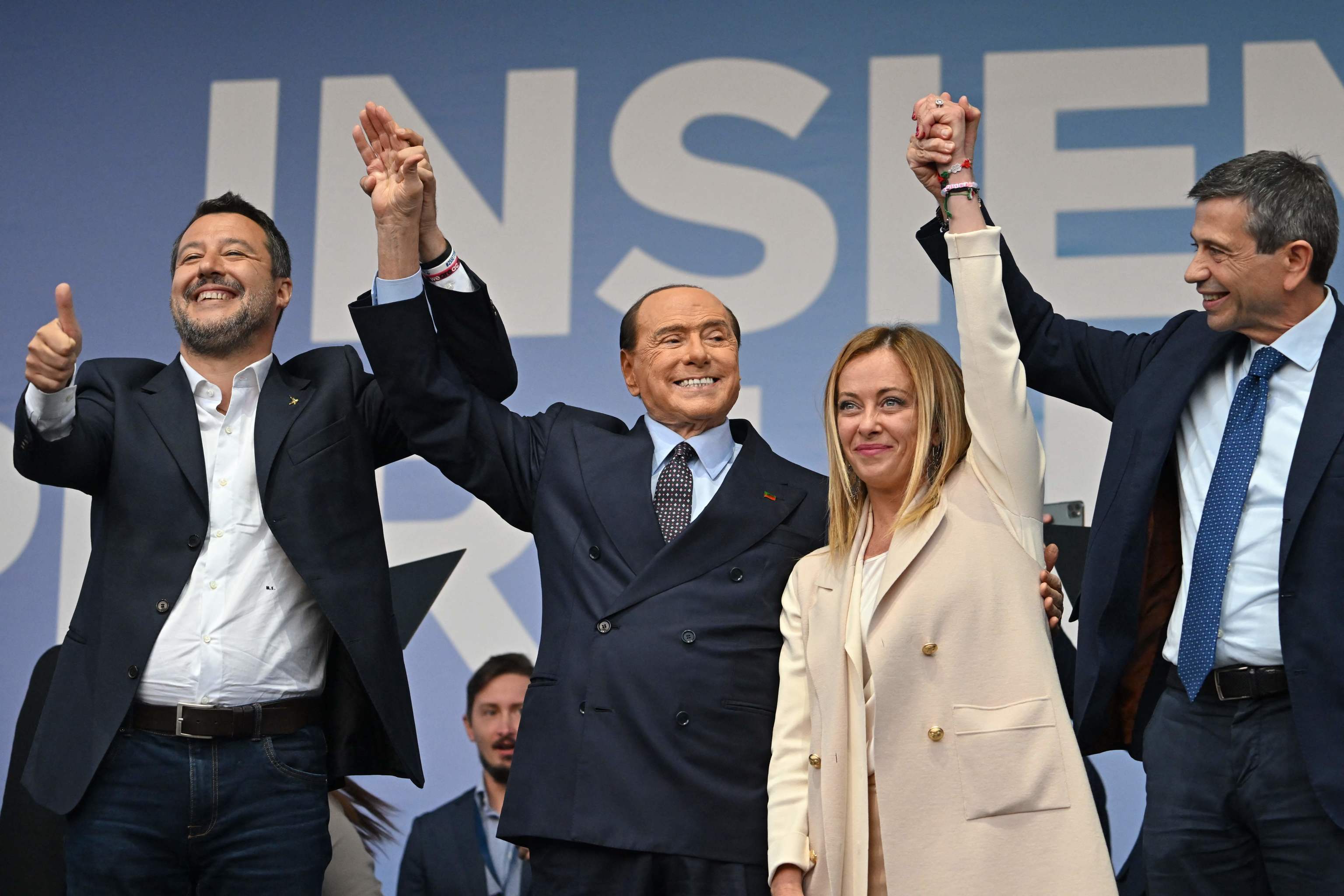 Matteo Salvini, Silvio Berlusconi y Georgia Meloni en un acto conjunto en Roma.