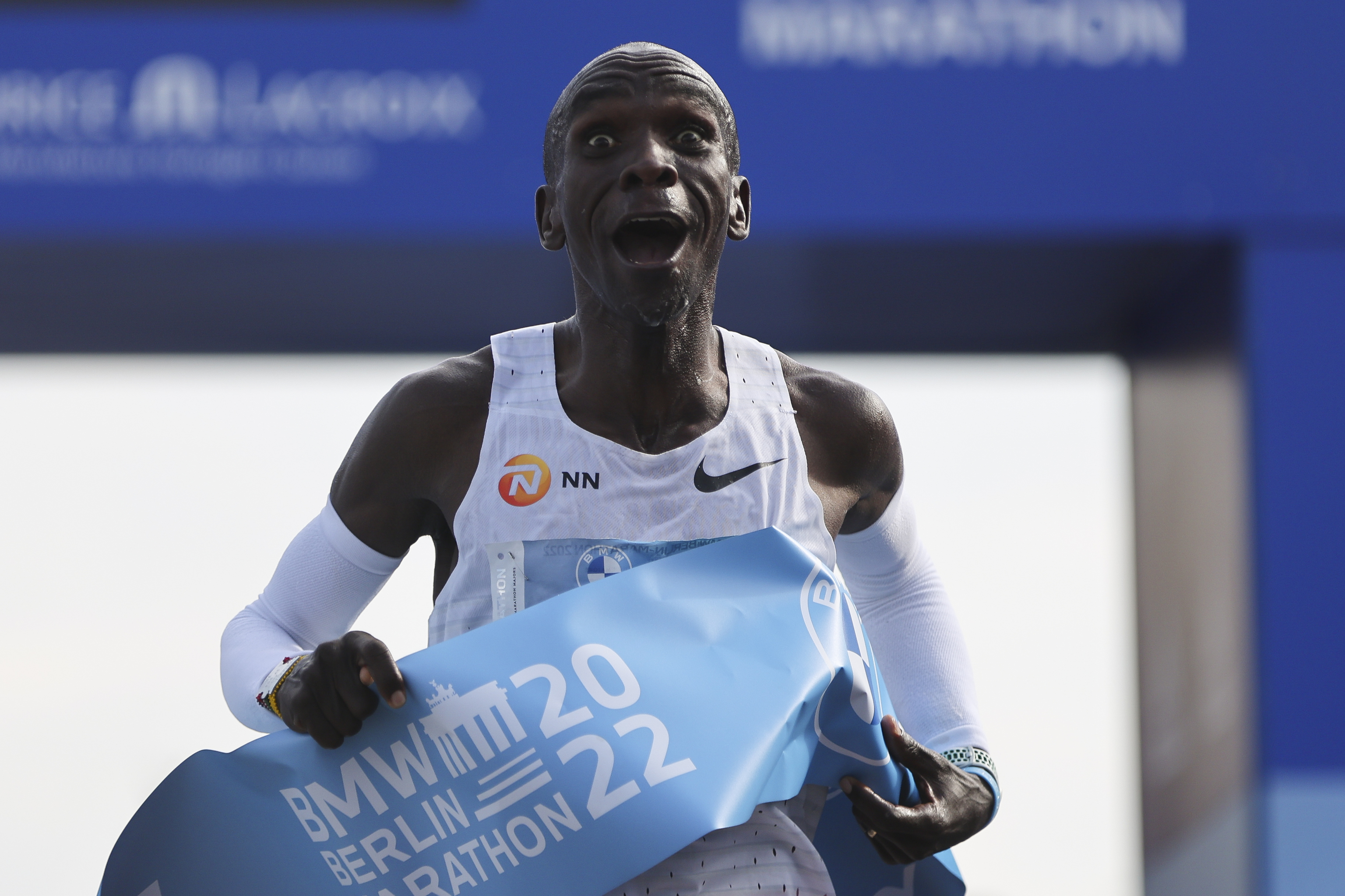 Kenya's Eliud  lt;HIT gt;Kipchoge lt;/HIT gt; crosses the line to win the Berlin Marathon in Berlin, Germany, Sunday, Sept. 25, 2022. Olympic champion Eliud  lt;HIT gt;Kipchoge lt;/HIT gt; has bettered his own world record in the Berlin Marathon.  lt;HIT gt;Kipchoge lt;/HIT gt; clocked 2:01:09 on Sunday to shave 30 seconds off his previous best-mark of 2:01:39 from the same course in 2018. (AP Photo/Christoph Soeder)