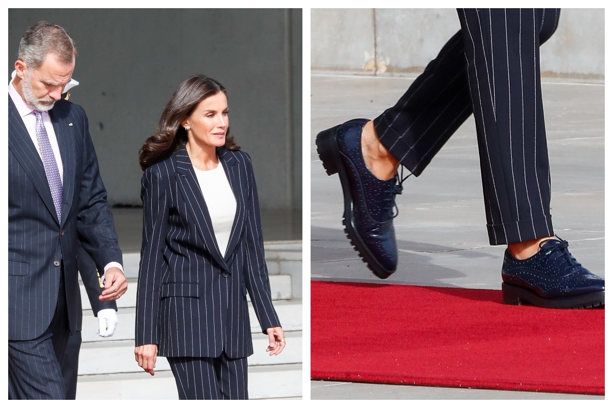 La Reina, con traje y zapatos masculinos.