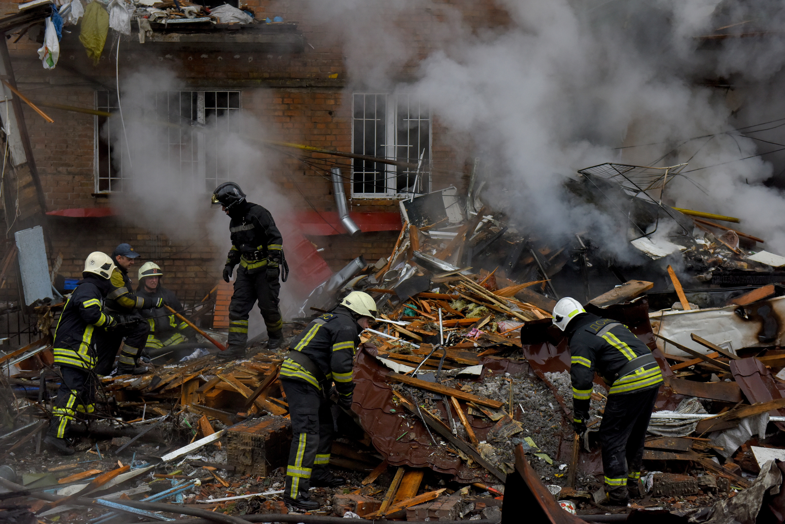 Firefighters work in kyiv after a Russian attack on the capital.