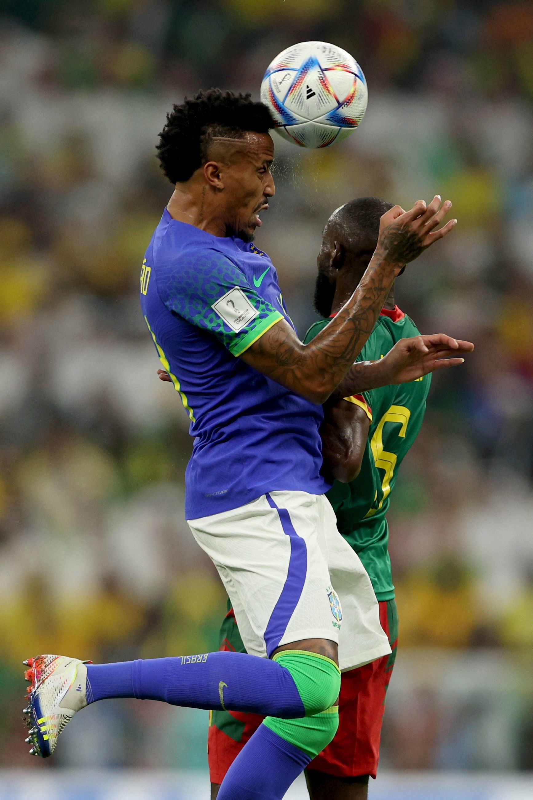 lt;HIT gt;Brazil lt;/HIT gt;'s defender #14 Eder Militao (L) heads the ball as he fights for it with Cameroon's forward #06 Nicolas Moumi Ngamaleu during the Qatar 2022 World Cup Group G football match between Cameroon and  lt;HIT gt;Brazil lt;/HIT gt; at the Lusail Stadium in Lusail, north of Doha on December 2, 2022. (Photo by Adrian DENNIS / AFP)