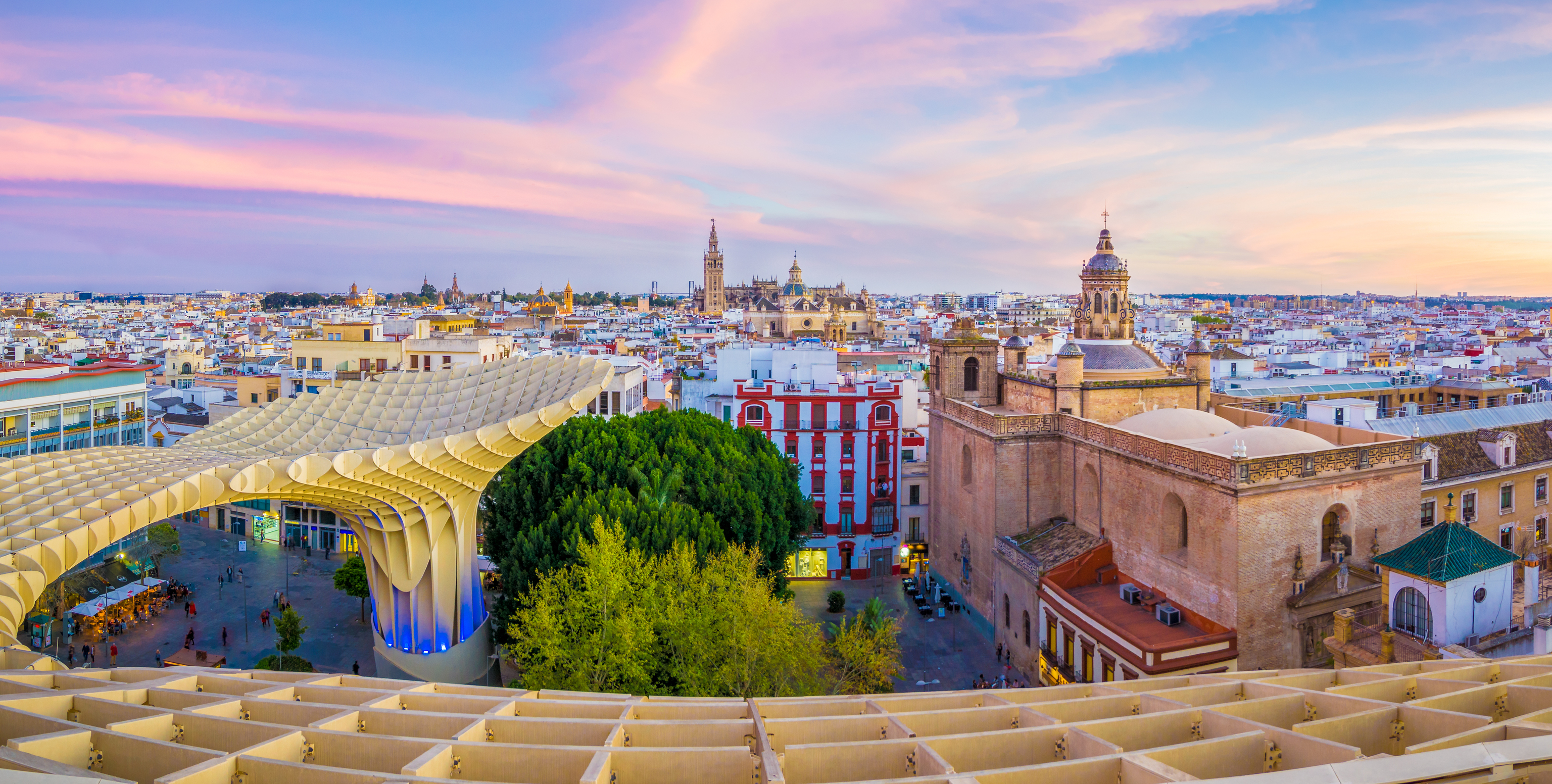 Panoramic view of Sevilla with the Guadalquivir River flowing through the city.
