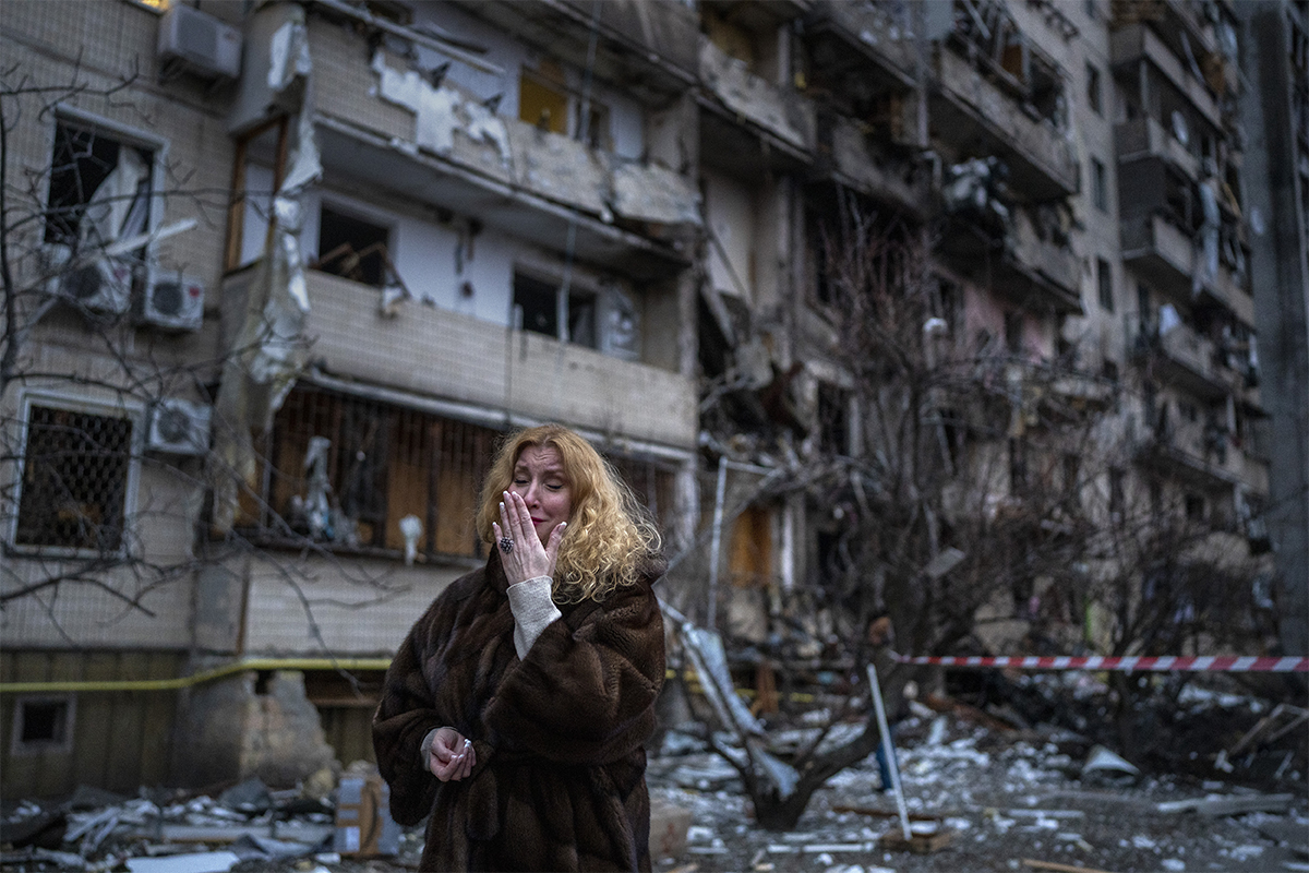 Natali Sevriukova, in front of her attacked building in kyiv.