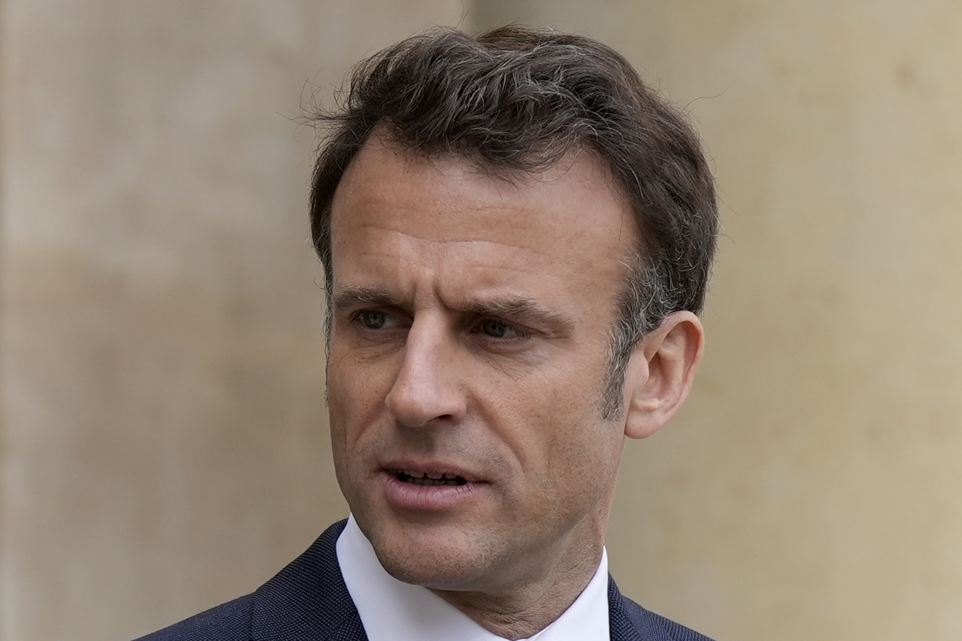 FILE - French President  lt;HIT gt;Emmanuel lt;/HIT gt;  lt;HIT gt;Macron lt;/HIT gt; looks on as he talks with Senegalese war veterans Friday, April 14, 2023 at the  lt;HIT gt;Elysee lt;/HIT gt; Palace in Paris. French President  lt;HIT gt;Emmanuel lt;/HIT gt;  lt;HIT gt;Macron lt;/HIT gt; is aiming to calm public anger that threatens the ambitions of his remaining four years in power with a first televised address to the nation on Monday April 17, 2023 since he enacted protest-igniting pension reforms. (AP Photo/Lewis Joly, Pool, File)