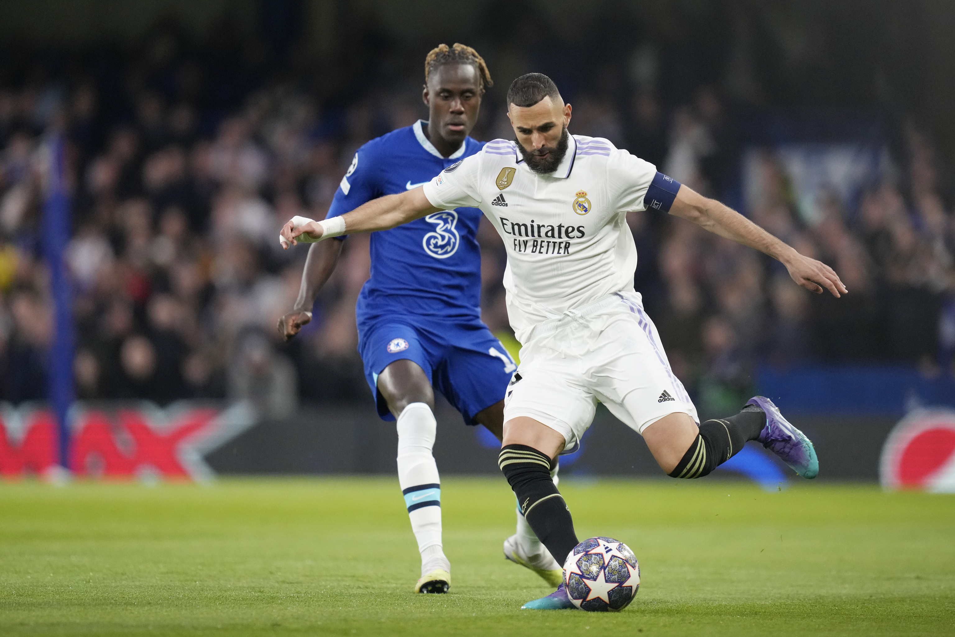 lt;HIT gt;Real lt;/HIT gt;  lt;HIT gt;Madrid lt;/HIT gt;'s Karim Benzema, right, and Chelsea's Trevoh Chalobah challenge for the ball during the Champions League quarterfinal second leg soccer match between Chelsea and  lt;HIT gt;Real lt;/HIT gt;  lt;HIT gt;Madrid lt;/HIT gt; at Stamford Bridge stadium in London, Tuesday, April 18, 2023. (AP Photo/Kirsty Wigglesworth)