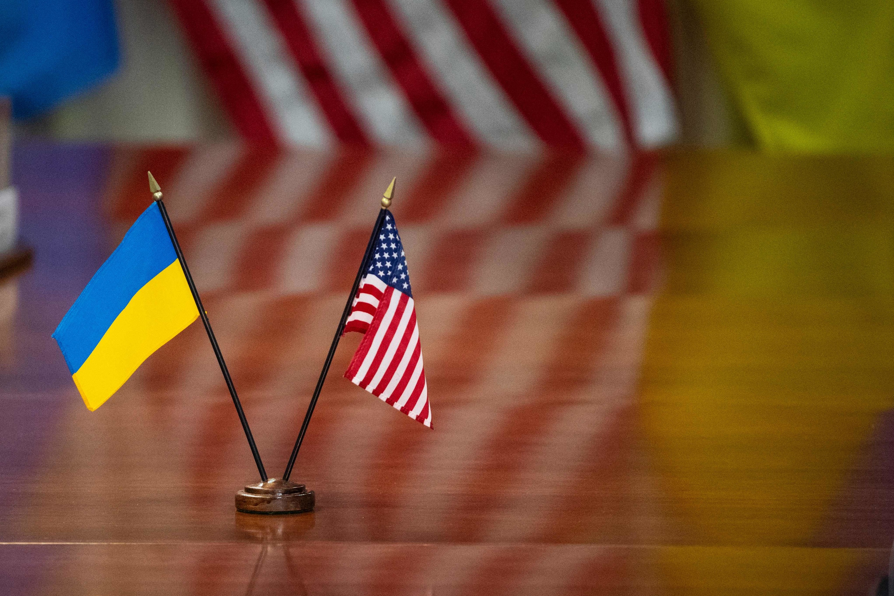 The national flags of Ukraine and the United States appear during a meeting