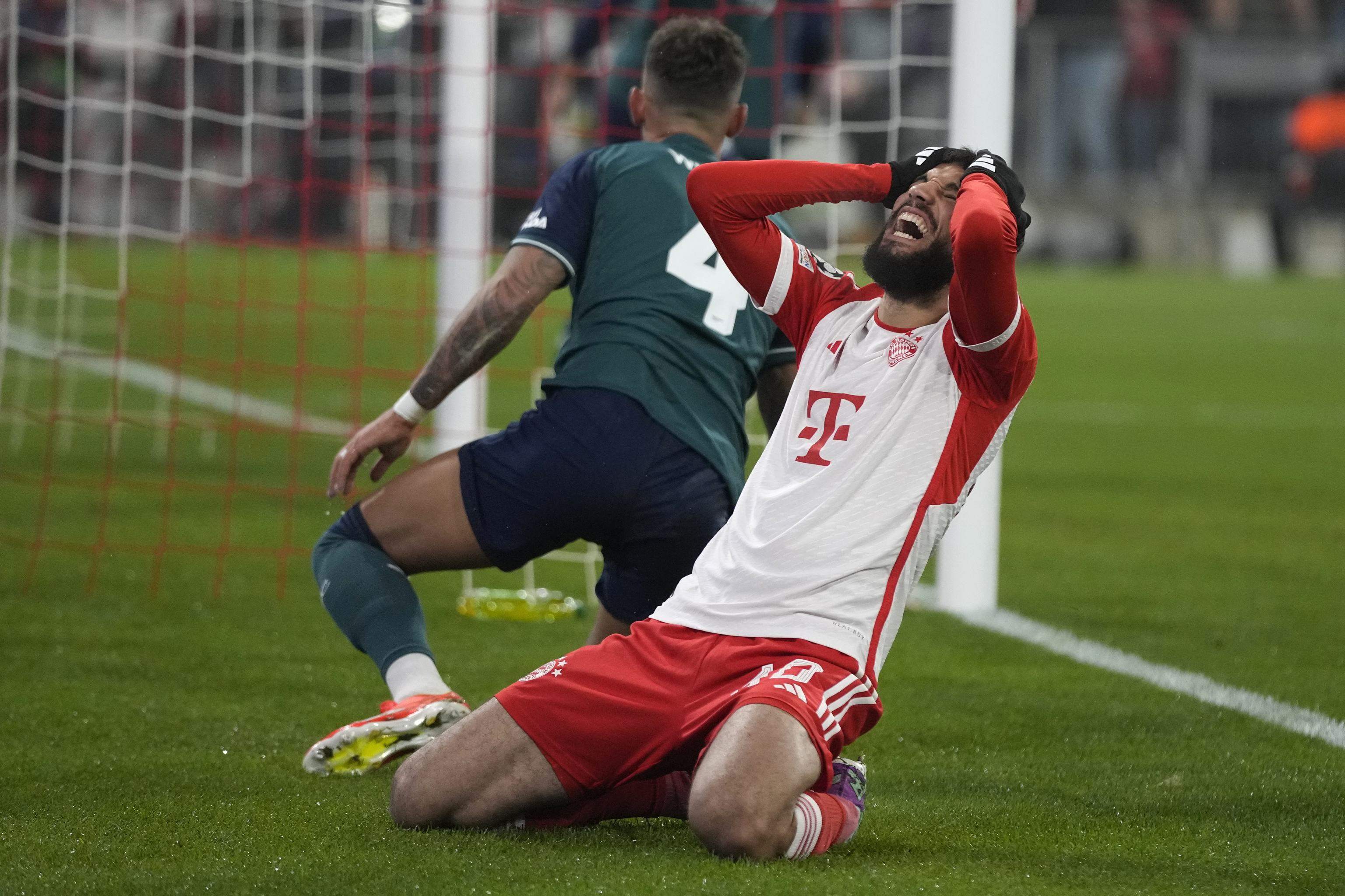 Bayern's Noussair Mazraoui reacts after missing a chance to score during the Champions League quarter final second leg soccer match between Bayern Munich and  lt;HIT gt;Arsenal lt;/HIT gt; at the Allianz Arena in Munich, Germany, Wednesday, April 17, 2024. (AP Photo/Matthias Schrader)