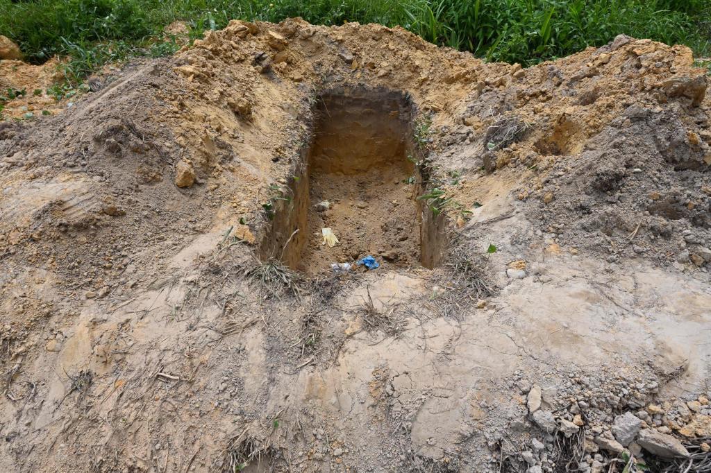 Detienen  a dos hombres en Trinidad y Tobago deshaciéndose de 56 cuerpos en un cementerio