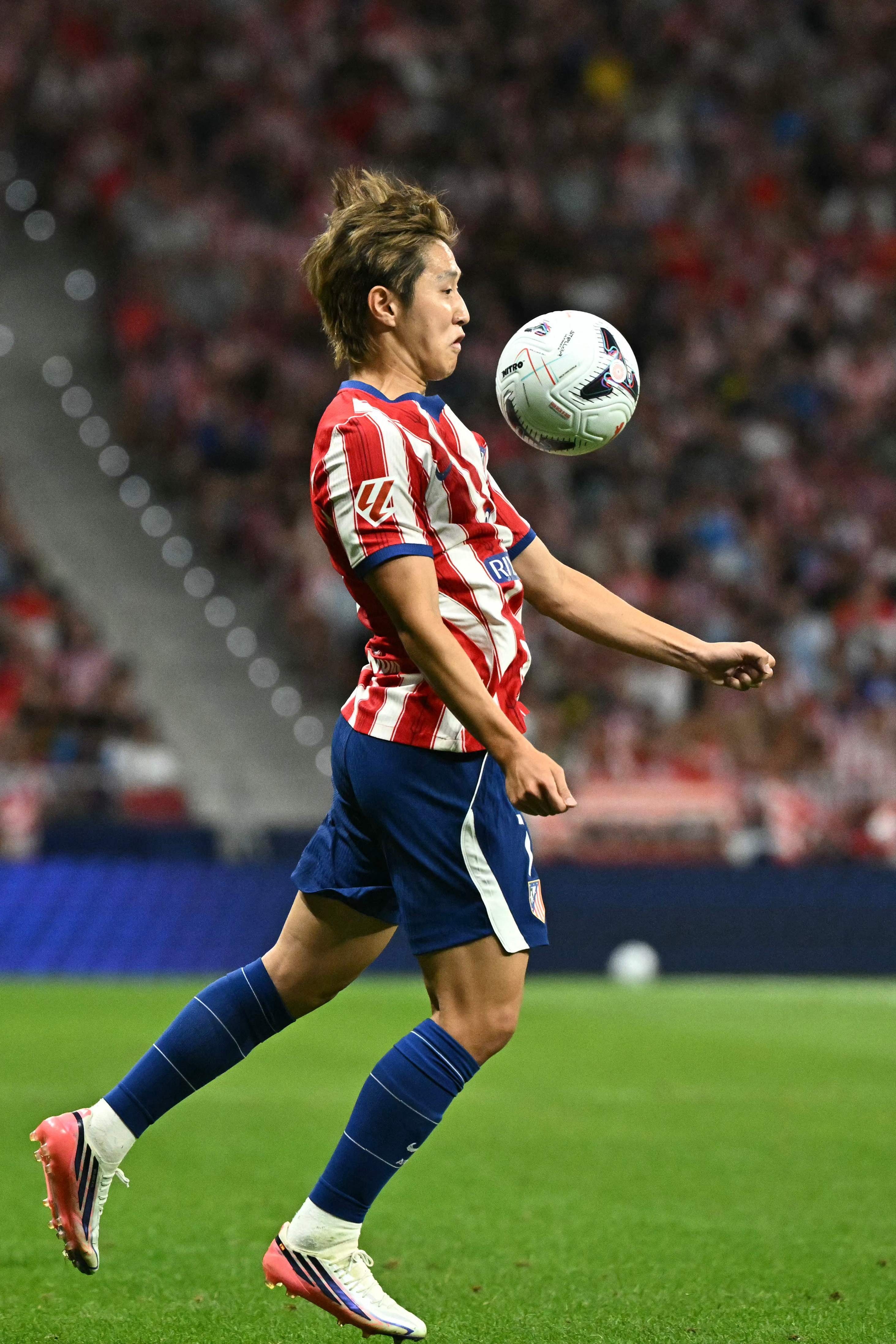 Atletico Madrid's South Korean midfielder #07 lt;HIT gt;Kang lt;/HIT gt;- lt;HIT gt;In lt;/HIT gt; Lee controls the ball before scoring a goal during the Spanish league football match between Club Atletico de Madrid and Malaga CF at the Metropolitano Stadium lt;HIT gt;in lt;/HIT gt; Madrid on August 19, 2026. (Photo by Javier SORIANO / AFP)