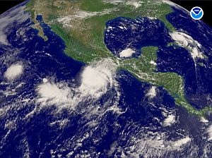 El huracn 'Hohn', en el centro; y el huracn 'Ernesto', arriba a la derecha. (Foto: AFP)