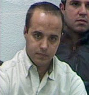 Mohamed Larbi ben Sellam, en el habitculo blindado durante una sesin del juicio. (Foto: EFE)