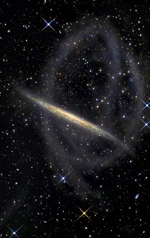 Galaxia espiral rodeada de estrellas y restos de una galaxia enana. (Foto: EFE | IAC)