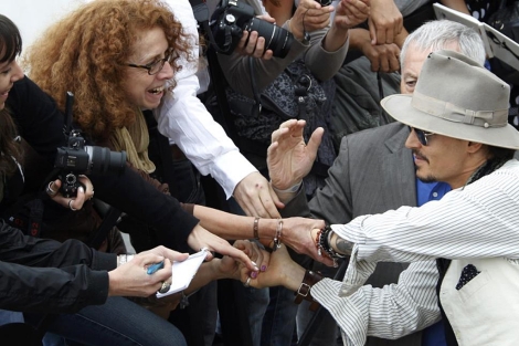 Johnny Depp, a su llegada al photocall para presentar la cinta. | Reuters