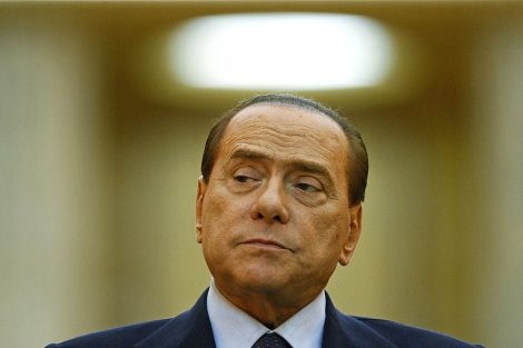 El primer ministro italiano, Silvio Berlusconi, en Bucarest. | Reuters