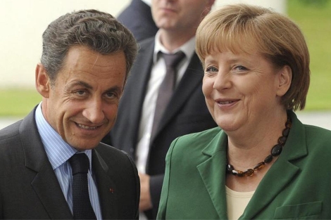 Nicolas Sarkozy y Angela Merkel antes del comienzo de su encuentro en Berln. | Efe