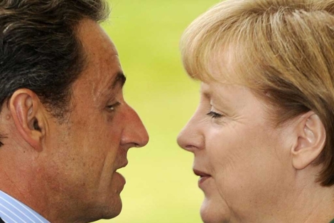 Sarkozy y Merkel se saludan al principio de su reunin. | Afp