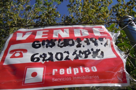 Cartel de una vivienda en venta en Madrid. | EM