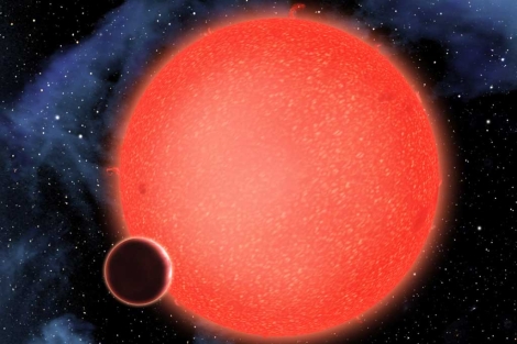 Recreacin artstica del nuevo planeta de agua orbitando su estrella. | NASA