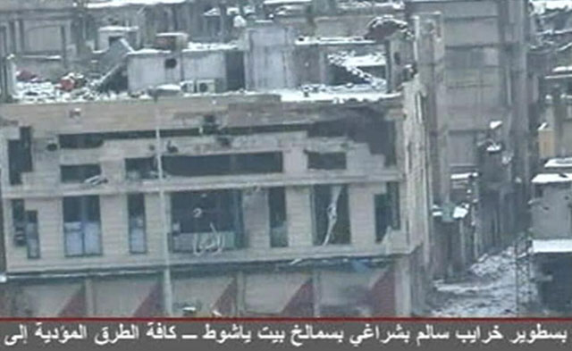 Edificios daados por los bombardeos sirios en el distrito de Bab Amro, en Homs. | Reuters