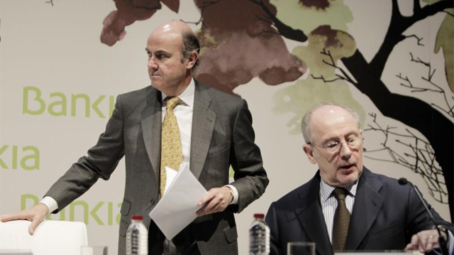 El ministro de Economa, Luis de Guindos (i), y el presidente de Bankia, Rodrigo Rato. | Alberto Di Lolli
