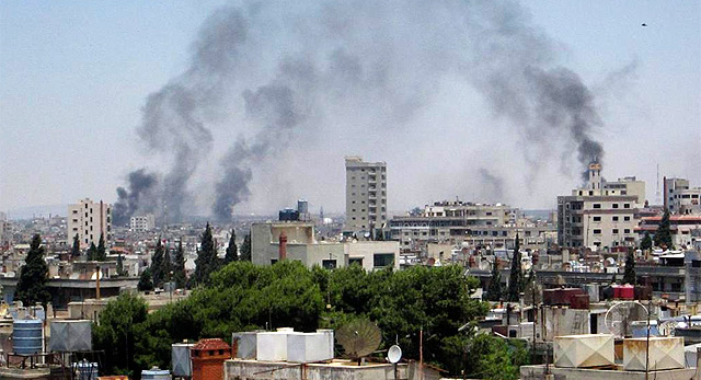 Imagen de los bombardeos sobre la ciudad de Homs. | Efe
