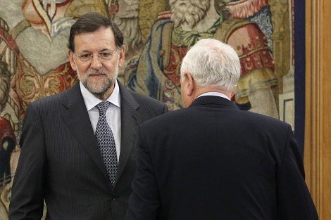 Rajoy, junto a Margallo, en el Consejo de Defensa Nacional. | Efe