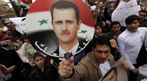 Pancarta de apoyo a Bashar Asad. | Reuters