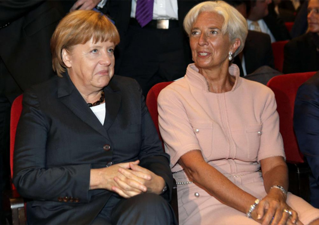 La directora gerente del FMI (d), en un acto con la canciller alemana. | Reuters