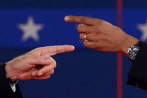 Romney y Obama se señalan mutuamente en su primer debate electoral. | AFP