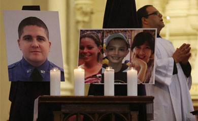 Las cuatro vctimas de los Tsarnaev, en una misa en Boston. | Getty/AFP