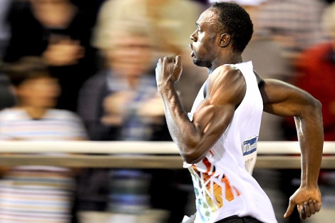 Usain Bolt, durante la carrera de los 200 metros. | AP