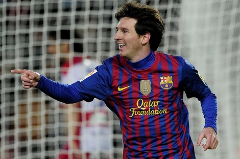 Messi celebra uno de sus goles ante el Granada. (Foto: Afp)