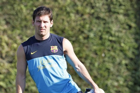 Leo Messi, junto a Mascherano, en un entrenamiento del Barcelona. (EFE)