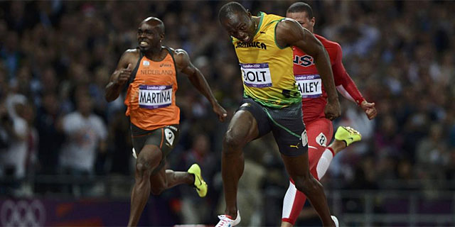 Bolt, en la meta de Londres, por delante de Bailey y Martina. (Foto: Reuters)