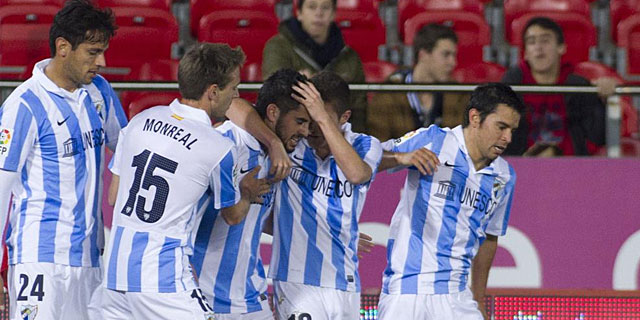 Los jugadores del Mlaga celebran uno de los goles ante el Mallorca | AFP