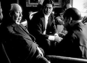 Alfred Hitchcock, Rafael y Luis Buñuel, durante la velada.